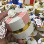 Round Bid Box With Pink Ribbon