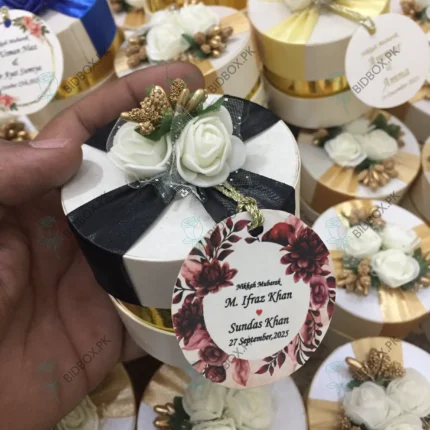 Round Bid Box With Off White Flowers & Black Ribbon