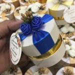 Round Bid Box With Blue Flowers & blue Ribbon