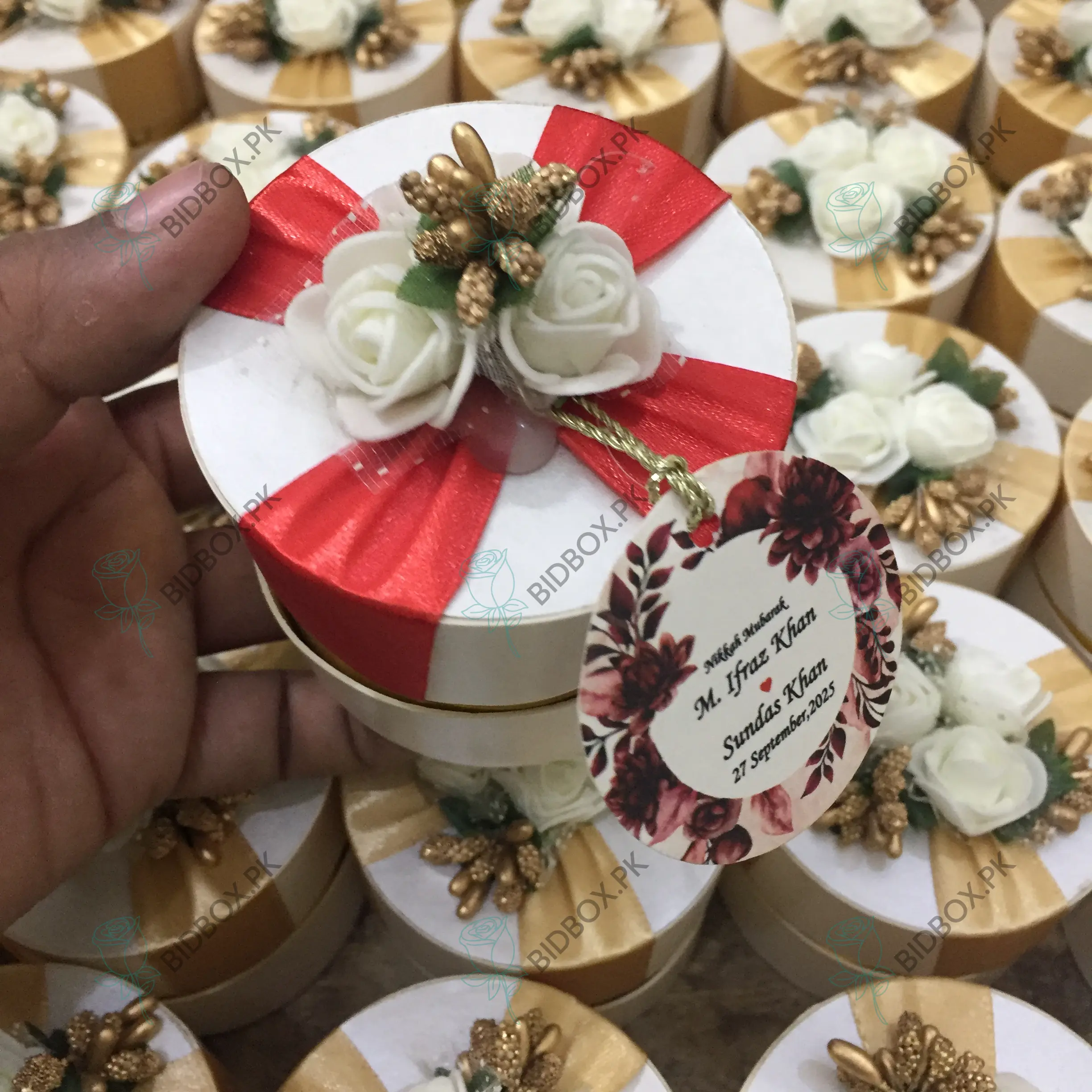 Round Bid Box With Red Ribbon and Flowers Round Bid Box With Red Ribbon and Flowers