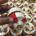 Round Bid Box With Red Ribbon and Flowers