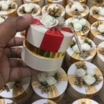 Round Bid Box With Red Ribbon and Flowers